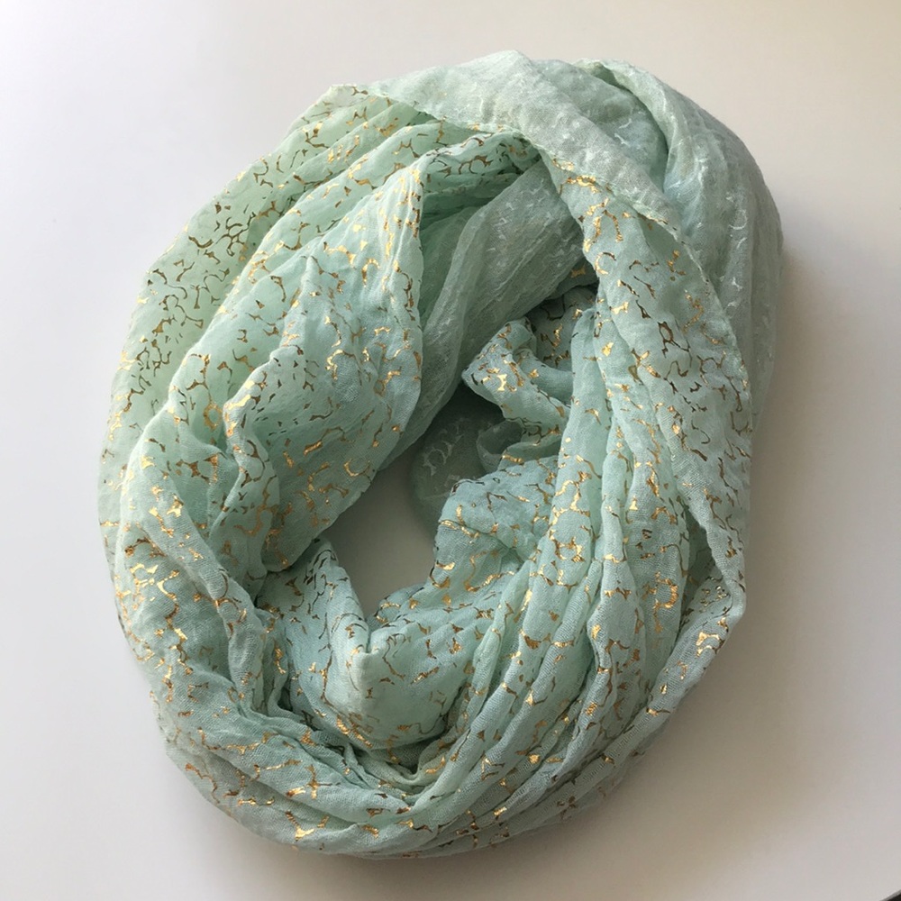 Mint green circle scarf with gold detailing.